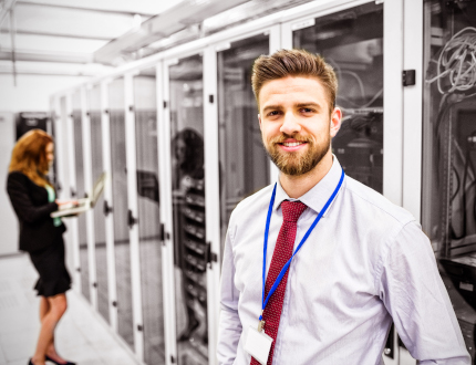 A man standing in a server room